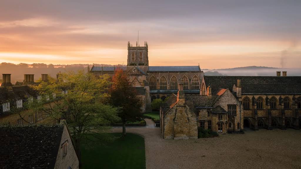 Sherborne Abbey and school buildings at sunrise